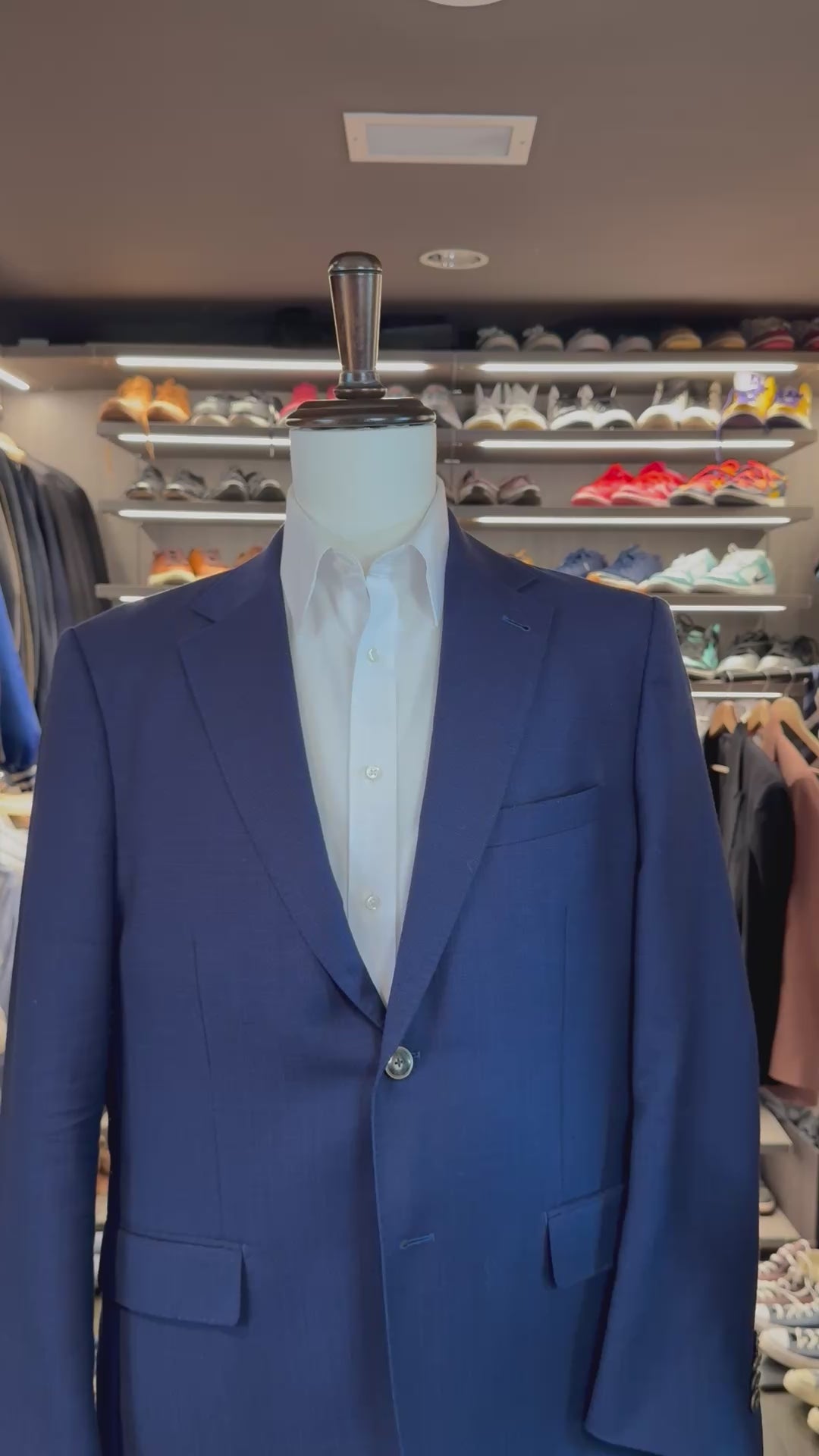 White Summit silk pocket square sliding into suit pocket — no folding required, permanently sewn signature fold by Stacy Claude Design