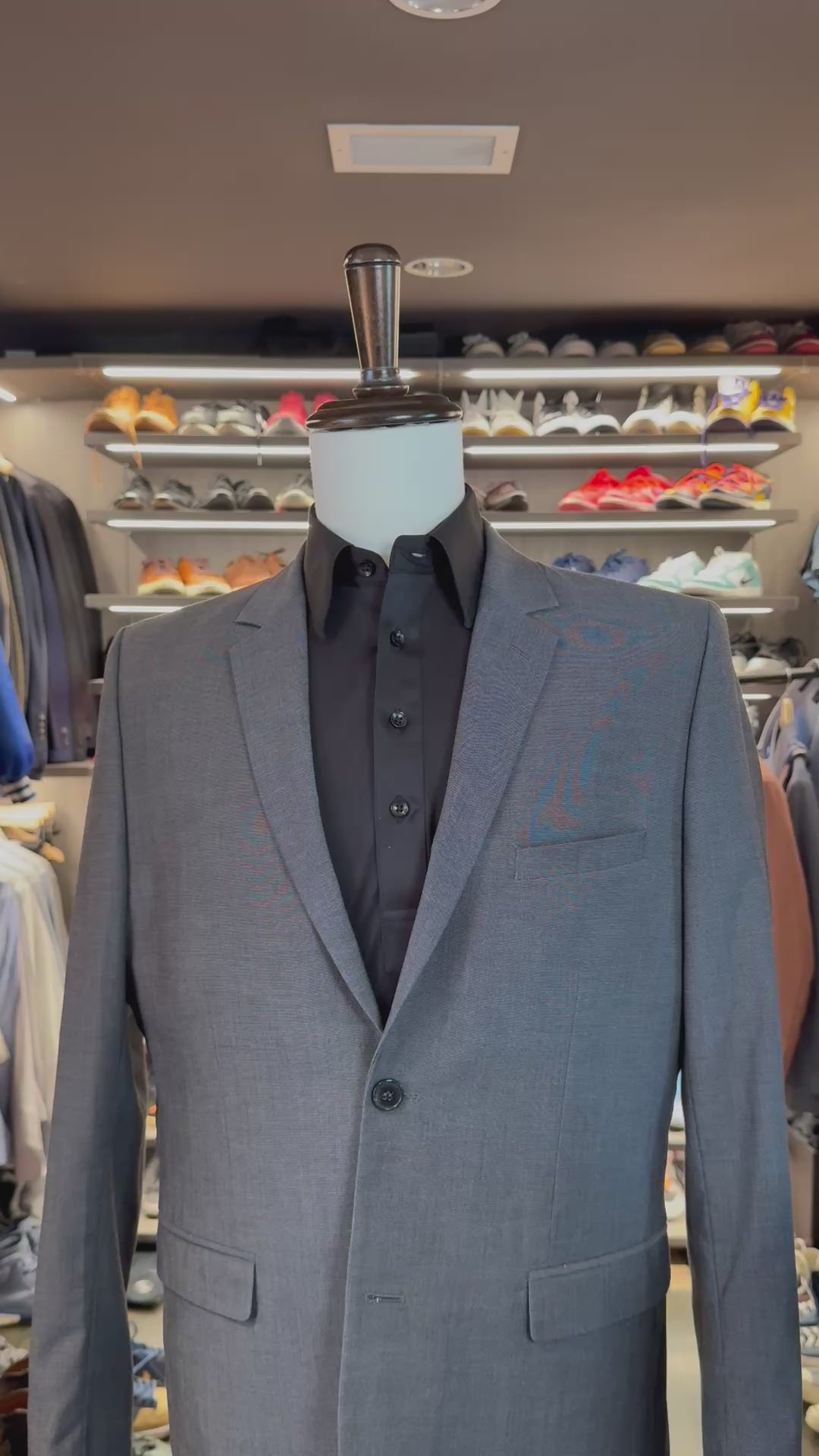 Black Legacy silk pocket square sliding into suit pocket — no folding required, permanently sewn presidential fold by Stacy Claude Design