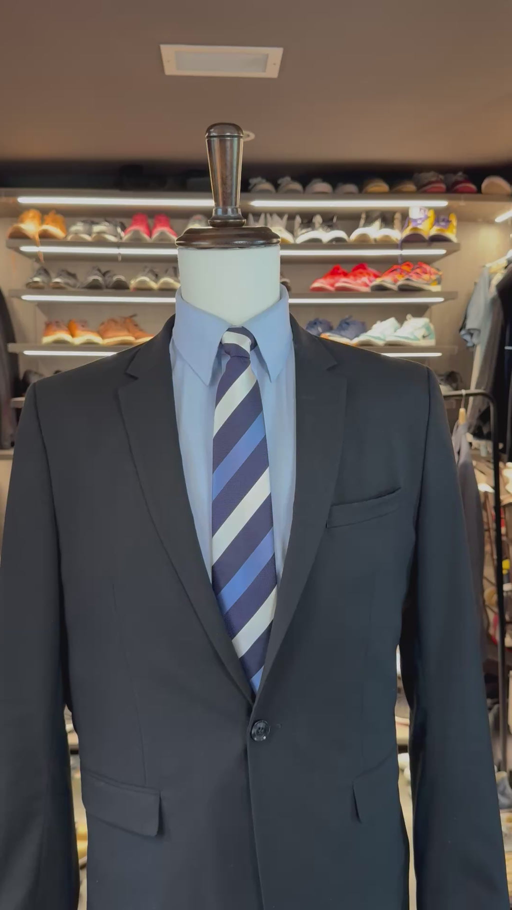 Blue Muse silk pocket square sliding into suit pocket — no folding required, permanently sewn signature fold by Stacy Claude Design