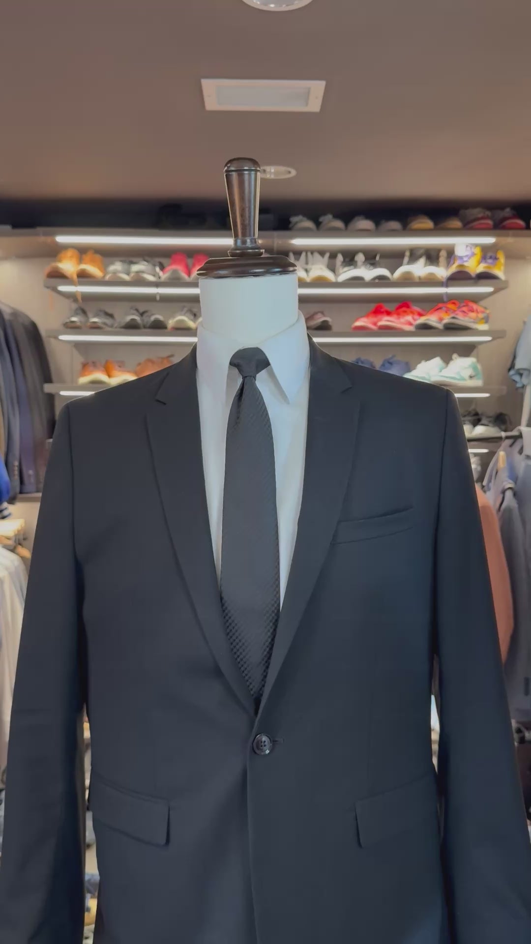 White Crystal silk pocket square sliding into suit pocket — no folding required, permanently sewn signature fold by Stacy Claude Design