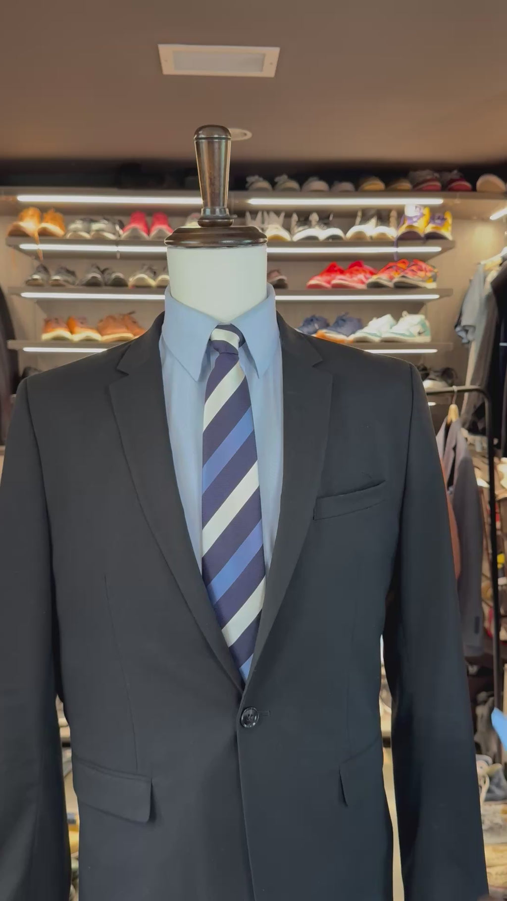 Blue Summit silk pocket square sliding into suit pocket — no folding required, permanently sewn signature fold by Stacy Claude Design