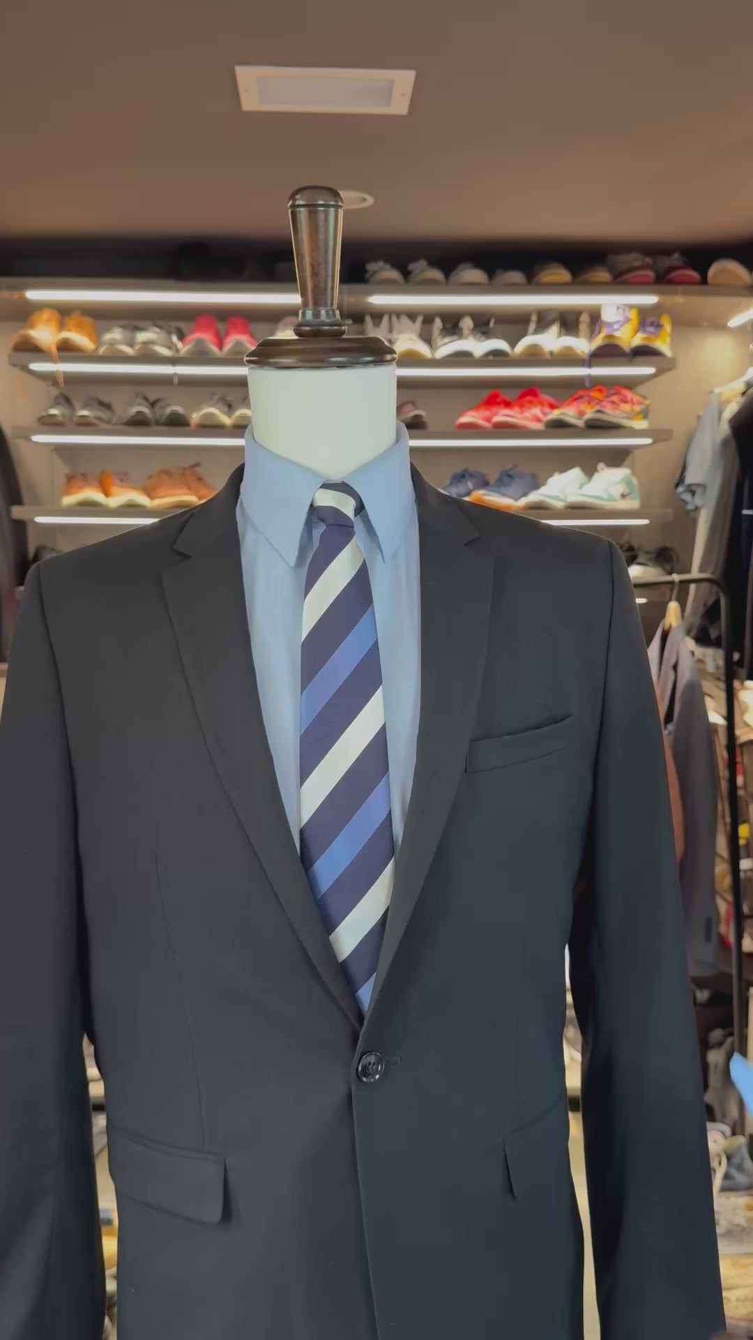 Blue Summit silk pocket square sliding into suit pocket — no folding required, permanently sewn signature fold by Stacy Claude Design