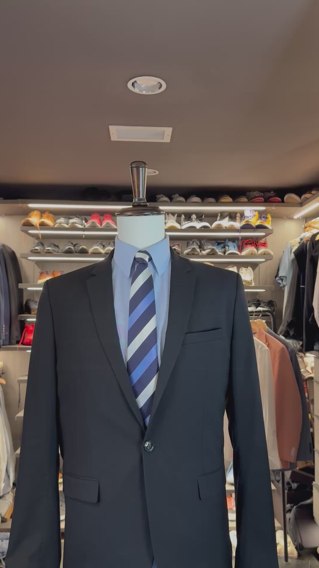 Blue Dash silk pocket square sliding into suit pocket — no folding required, permanently sewn signature fold by Stacy Claude Design