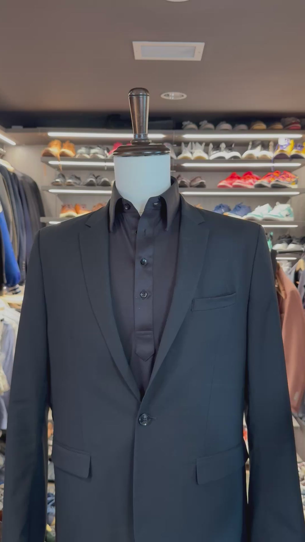 Grey Dash silk pocket square sliding into suit pocket — no folding required, permanently sewn signature fold by Stacy Claude Design