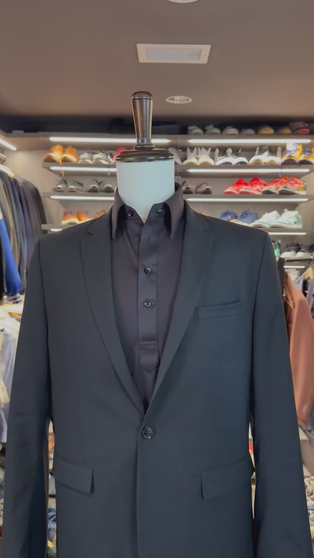 Grey Legacy silk pocket square sliding into suit pocket — no folding required, permanently sewn presidential fold by Stacy Claude Design