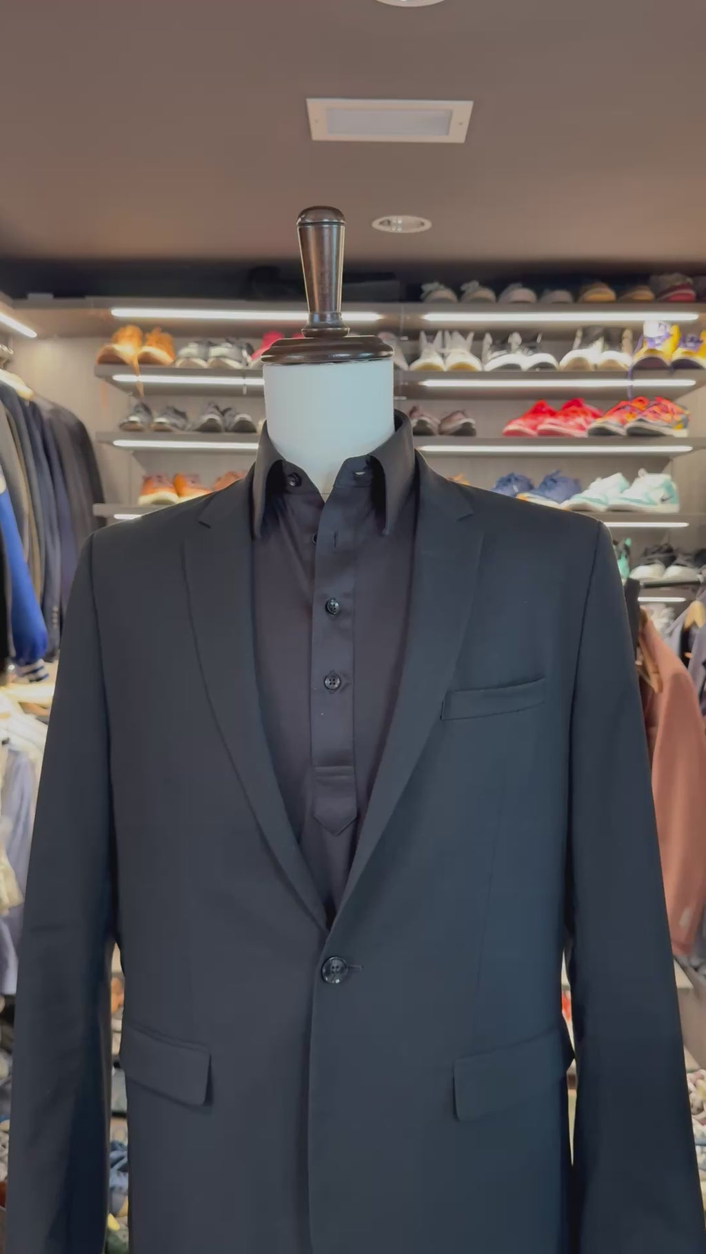 Grey Summit silk pocket square sliding into suit pocket — no folding required, permanently sewn signature fold by Stacy Claude Design
