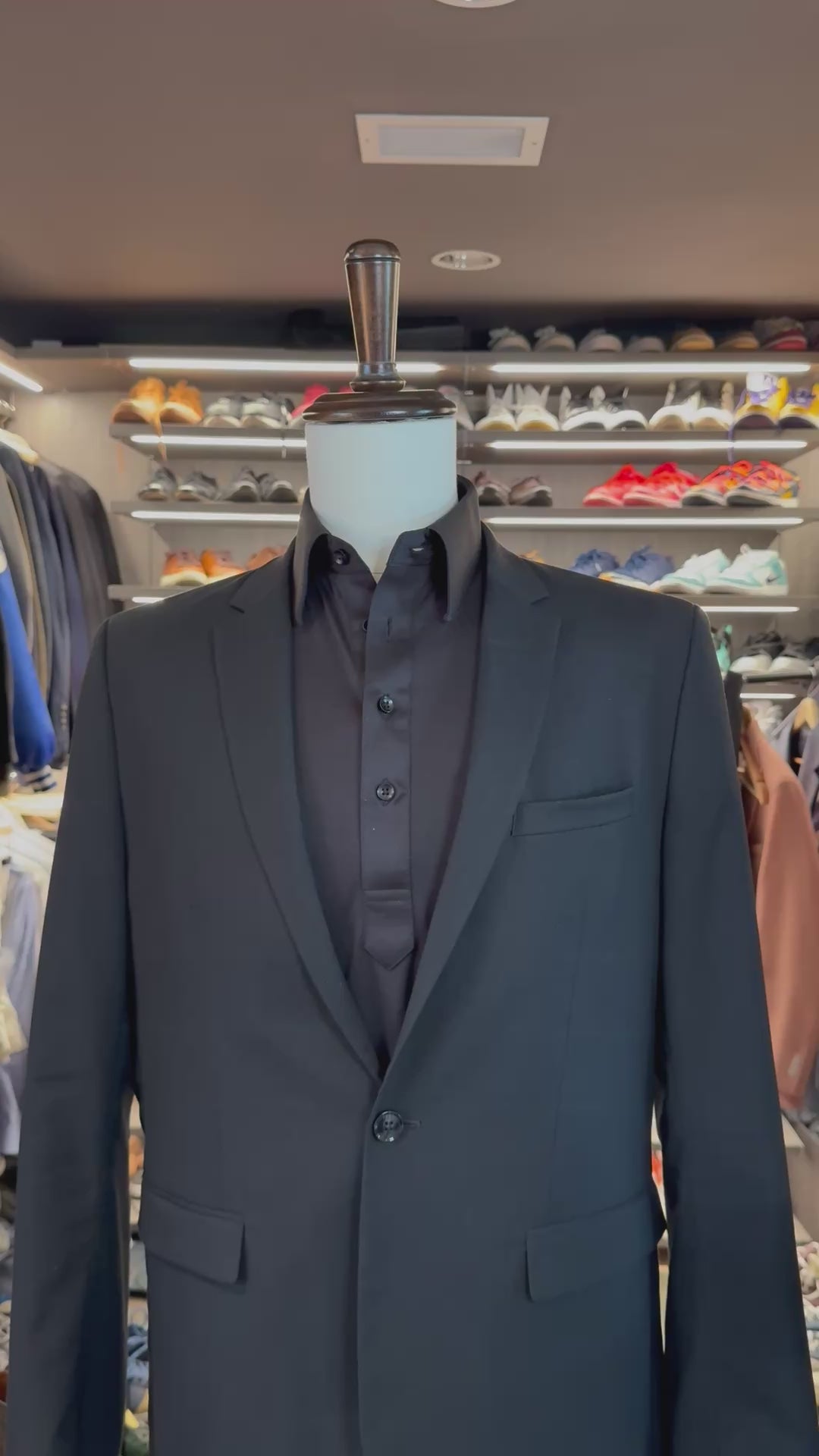 Grey Summit silk pocket square sliding into suit pocket — no folding required, permanently sewn signature fold by Stacy Claude Design
