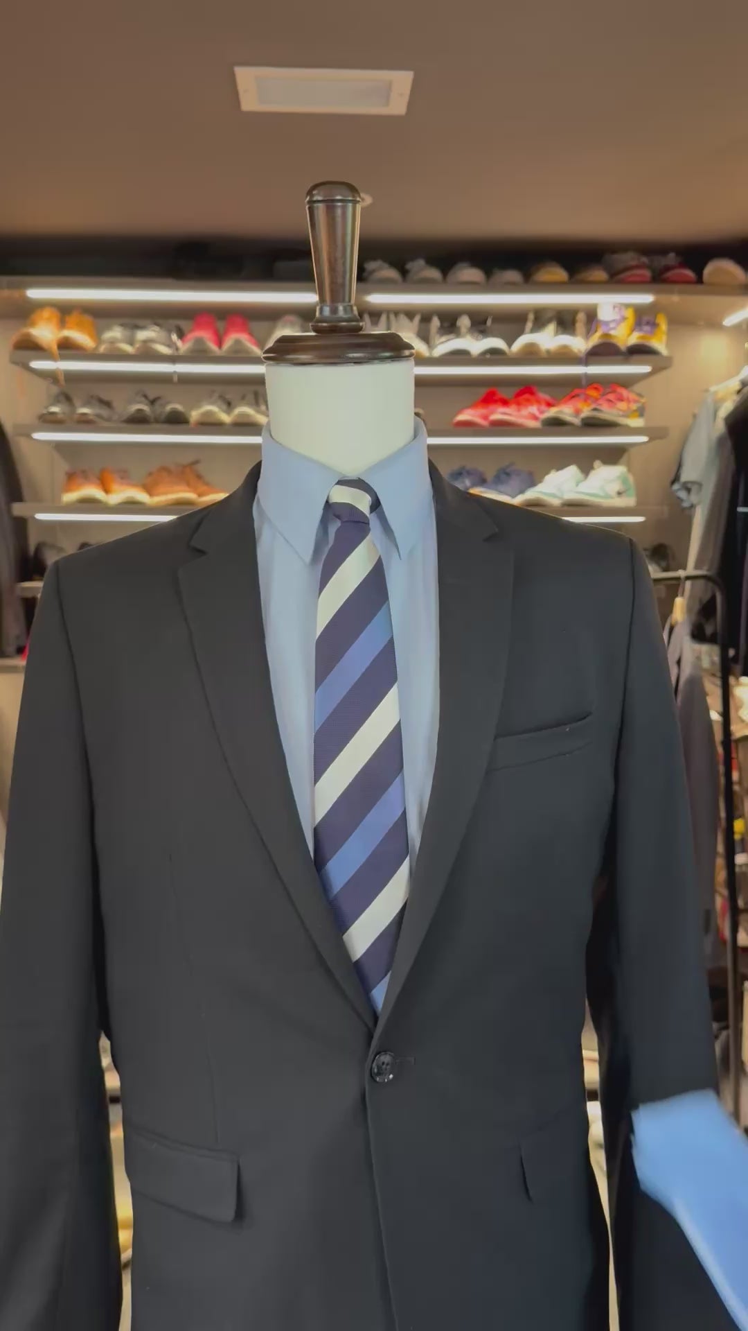 Blue Magic silk pocket square sliding into suit pocket — no folding required, permanently sewn signature fold by Stacy Claude Design