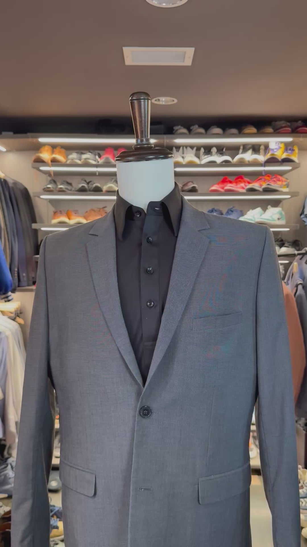 Black Summit silk pocket square sliding into suit pocket — no folding required, permanently sewn signature fold by Stacy Claude Design