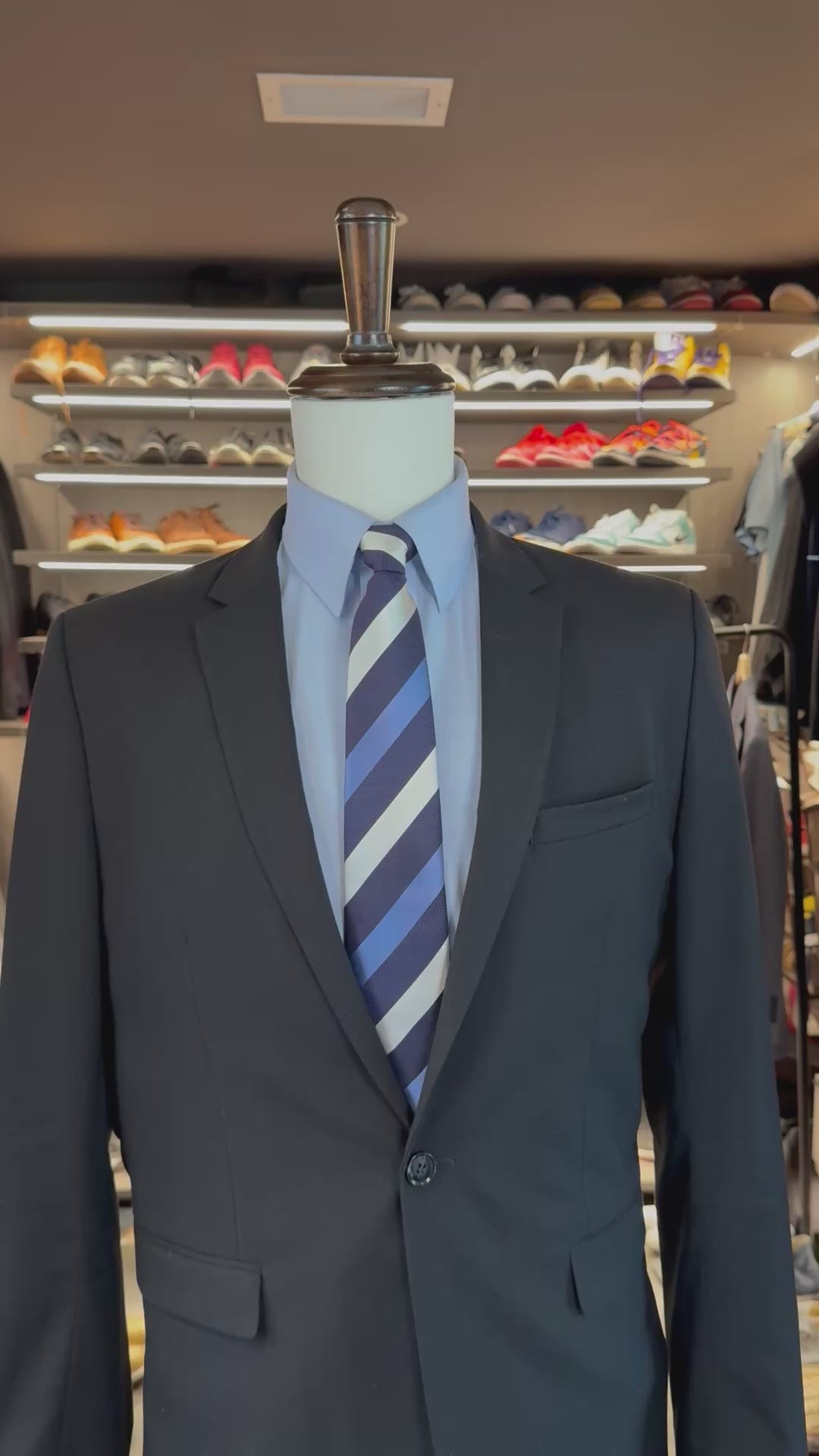 Blue Cloud 9 silk pocket square sliding into suit pocket — no folding required, permanently sewn puff fold by Stacy Claude Design