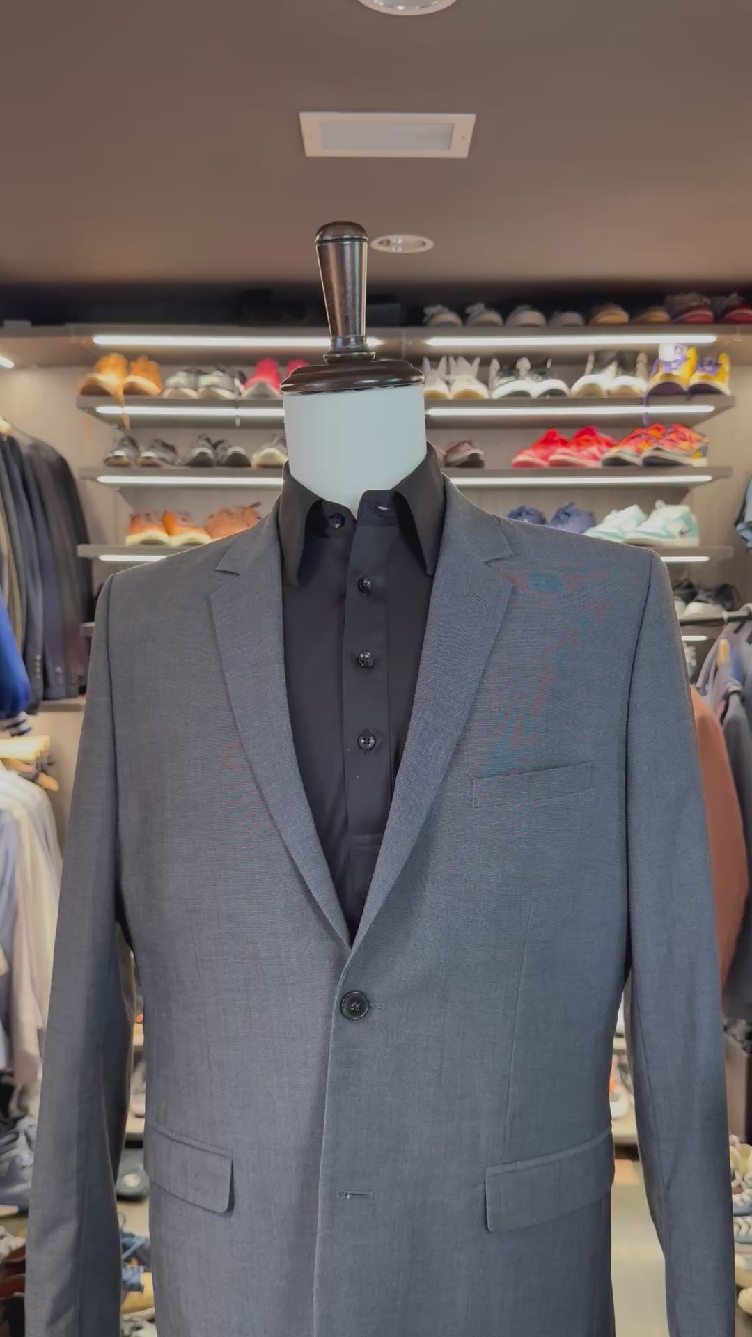 Black Magic silk pocket square sliding into suit pocket — no folding required, permanently sewn signature fold by Stacy Claude Design