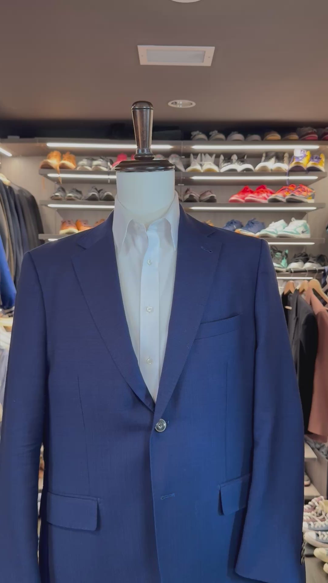 White Legacy silk pocket square sliding into suit pocket — no folding required, permanently sewn presidential fold by Stacy Claude Design