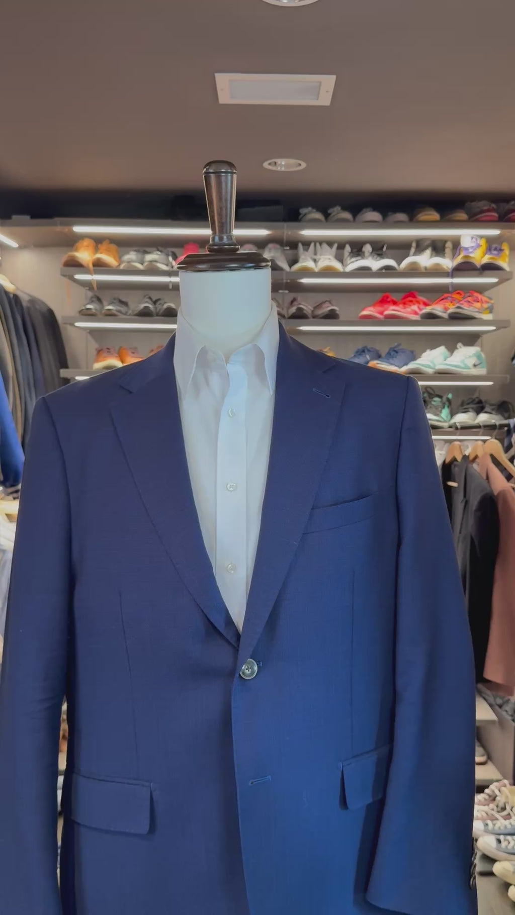 White Cloud 9 silk pocket square sliding into suit pocket — no folding required, permanently sewn puff fold by Stacy Claude Design